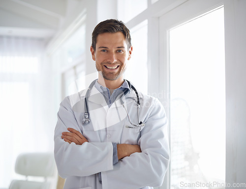 Image of Portrait of happy man, doctor and arms crossed in hospital for healthcare management, clinic services and help. Male medical employee, professional therapist and confident smile, trust and integrity