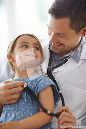 Image of Child, doctor and stethoscope of pediatrician for healthcare consulting, check lungs and listening to heartbeat. Happy girl kid, man and chest for clinic consultation, medical analysis and assessment