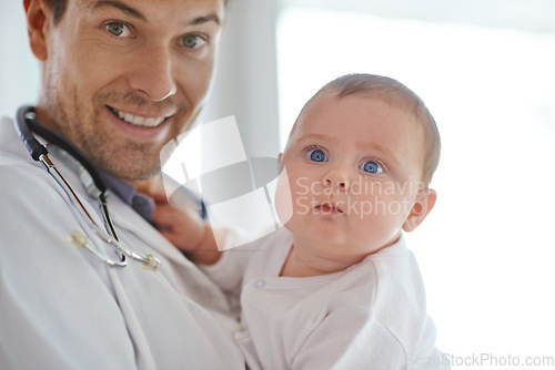 Image of Portrait, pediatrician and holding baby in clinic assessment, medical support and growth. Newborn kids, happy man and pediatrics doctor in hospital for healthcare, consulting and wellness of children