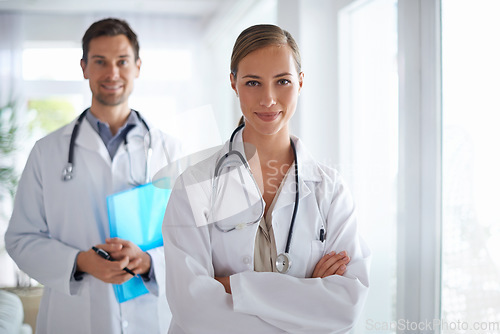 Image of Portrait of woman, doctors and leadership with arms crossed in hospital for healthcare, management and clinic services. Medical employees, manager and teamwork in collaboration, support and integrity