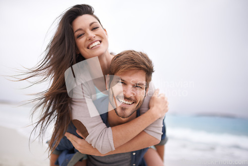 Image of Hug, beach and portrait of couple piggyback with love, smile and laugh while bonding outdoor. Face, embrace and happy man with woman at the ocean for travel, freedom or vacation, holiday or Bali trip