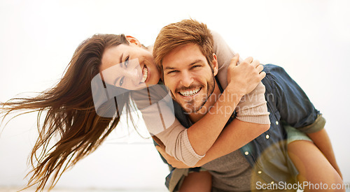 Image of Love, hug and portrait of couple piggyback at beach, hug and laughing while bonding outdoor. Face, embrace and happy man with woman at the ocean for travel, freedom or vacation, holiday or Miami trip