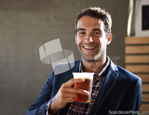 Image of Business man at pub, smile with beer in portrait and relax, social time or event with professional person at bistro. Hospitality industry, male customer at restaurant and enjoying alcohol drink