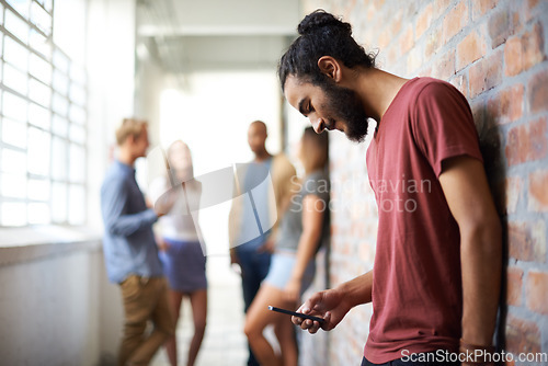 Image of School, phone and college with man in hallway for social media, technology or internet. Eduction, learning and scholarship with student on university campus for connection, contact or text message