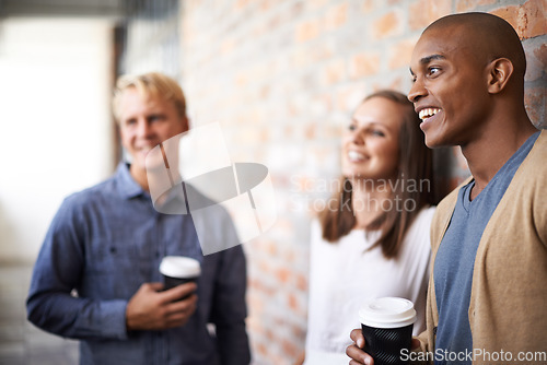 Image of Laughing, talking and friends with coffee in a college hallway for funny chat, happiness and drink. Black man and woman with students at campus or university for discussion about education or project