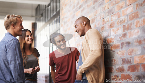 Image of Talking, laughing and college friends or students in a hallway for a happy discussion. Group of diversity men and a woman at campus or university for a funny conversation about education career