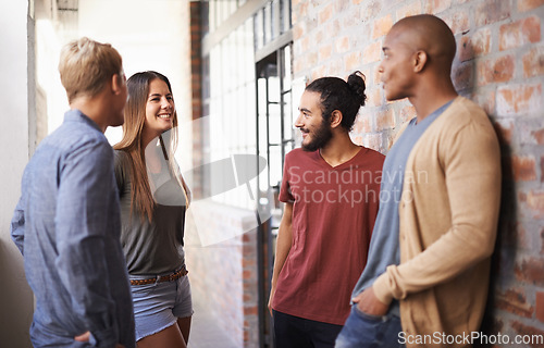 Image of College, friends or students talking in a hallway for discussion, happiness or a chat. Group of diversity men and a woman at campus or university to talk about education, learning or school work