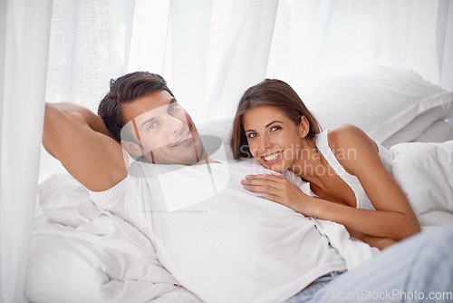Image of Love, bedroom portrait and happy couple relax for morning peace, calm and bonding quality time together in Toronto Canada. Smile, vacation and romantic people in hotel bed for Valentines Day holiday
