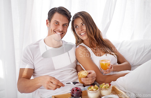 Image of Breakfast in bed, portrait and morning couple relax with food, love bond and enjoy quality time together. Marriage romance, meal or happy people in hotel bedroom for Valentines Day in Toronto Canada