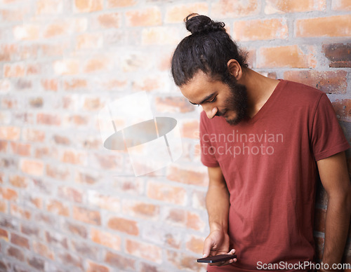 Image of School, phone and university with man at brick wall space for social media, technology or internet. Eduction, learning and scholarship with male student on college campus for connection and contact