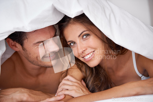 Image of Portrait, couple and love in bed, waking up and bonding in bedroom together, flirting and romantic. Face, man and woman relax, intimate and resting at hotel for valentines day, anniversary or bond