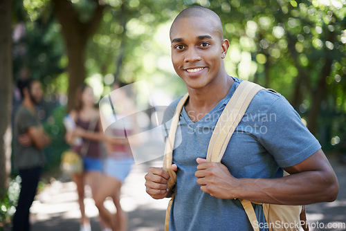 Image of Man, student park and portrait with backpack by a campus nature with smile and ready for study. Happiness, young and African male face in college and university outdoor with education and school bag