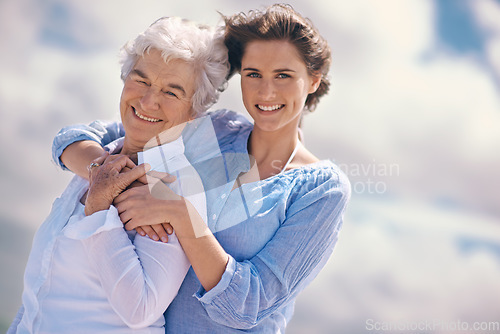 Image of Woman, senior mother and portrait by sky with hug, happiness, love or smile for mothers day on vacation. Elderly lady, daughter or happy with care, bond or outdoor by clouds for holiday in retirement