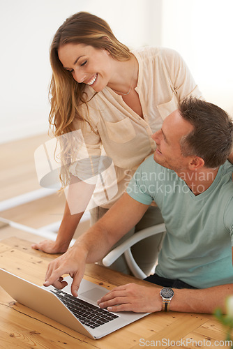 Image of Computer, pointing and happy couple on home internet for online planning, website and to check application together. Support, talking and woman, partner or people with choice or reading on laptop