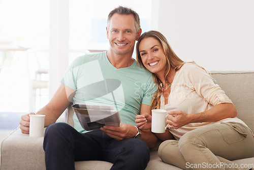 Image of Newspaper, portrait and happy couple on sofa with love, tea and affection at home for holiday home or vacation with news. Mature partner, woman or people on couch together smile with paper and coffee