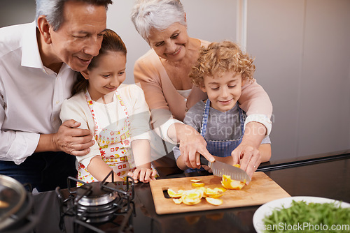 Image of Food, happy children or grandparents teaching cooking skills for a healthy dinner with fruit or vegetables at home. Kids learning, knife or grandmother with old man or diet meal nutrition in kitchen