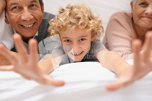 Image of Portrait, grandparents or boy playing in bedroom to relax together for bonding in Australia with love or care. Morning, faces or happy grandmother with funny kid or old man to enjoy quality bed time
