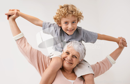 Image of Portrait, airplane and grandmother with child embrace, happy and bonding against wall background. Love, face and senior woman with grandchild having fun playing, piggyback and enjoying game together