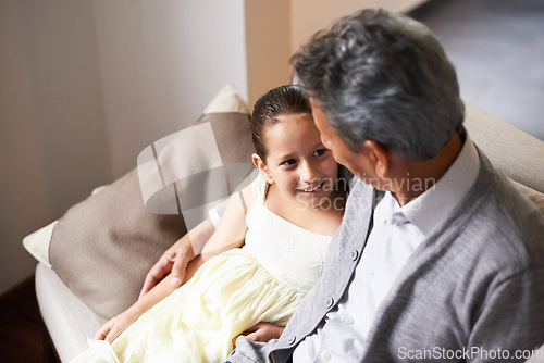 Image of Love, smile or happy grandfather with a girl hugging with care in family home on holiday break together. Elderly grandparent, kid or old man relaxing or bonding to enjoy quality time in retirement