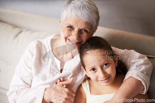 Image of Portrait, smile or grandma hugging a happy girl with love in family home on holiday break together. Child, embrace or elderly grandmother relaxing or bonding to enjoy quality time in retirement