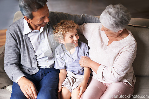 Image of Boy, relax or happy grandparents with a child talking, laughing or hugging with love in family home. Elderly grandma, old man or kid relaxing, bonding or enjoying quality time together in retirement