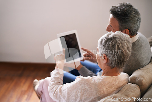 Image of Tablet, mockup or old couple streaming movie or film on online subscription in retirement at home together. Screen, relaxing or back of senior woman loves watching fun videos with an elderly man