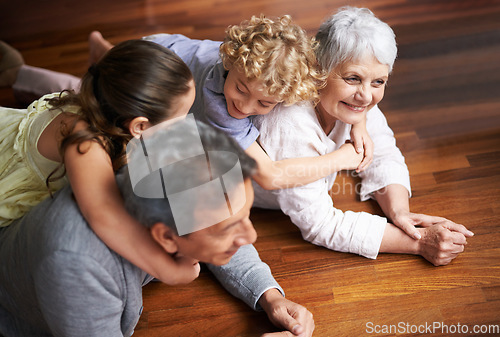 Image of Hug, floor or happy grandparents with children playing together in lovely family home in retirement. Senior grandma, piggyback or kids siblings relaxing or bonding to enjoy quality time with old man