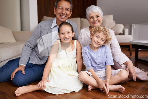 Image of Portrait, floor or happy grandparents with kids sit smiling together in family home in retirement. Senior grandma, smile or children siblings relaxing or bonding to enjoy quality time with old man