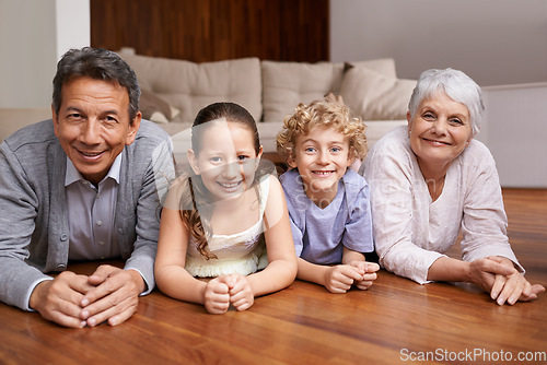 Image of Portrait, relax or grandparents on the floor with happy kids smiling together in family home in retirement. Senior grandma, smile or fun children siblings bonding to enjoy quality time with old man