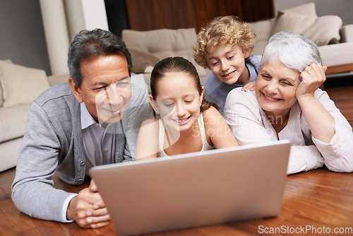 Image of Laptop, relax or grandparents with happy kids for movie streaming online subscription in a family at home. Children siblings, floor or grandmother watching videos in retirement with a senior old man