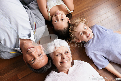 Image of Portrait, floor or top view of grandparents with happy kids smiling together in family home or retirement. Senior grandma, relax or fun children siblings bonding to enjoy quality time with old man