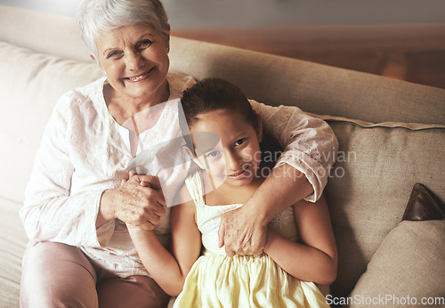 Image of Portrait, smile or happy grandmother with a child hugging with love in family home on holiday break. Elderly grandma, kid or old woman relaxing or bonding to enjoy quality time together in retirement