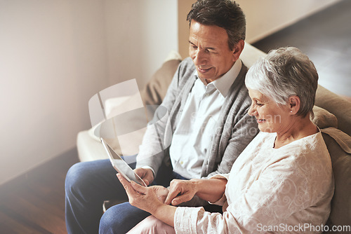 Image of Tablet, relax or old couple streaming movies or film on online subscription in retirement at home together. Love, internet or senior woman watching videos with a happy elderly man in living room sofa