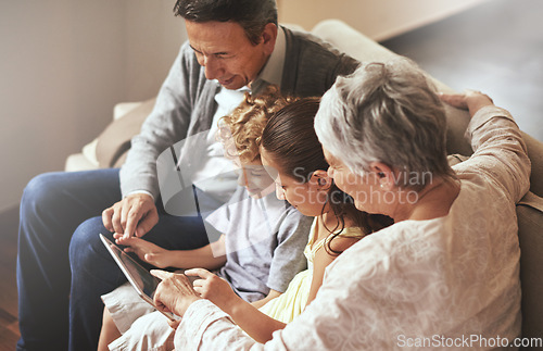 Image of Tablet, children or grandparents streaming movie or film on online subscription in retirement at home together. Kids siblings, relaxing or grandmother loves watching fun videos with a senior old man