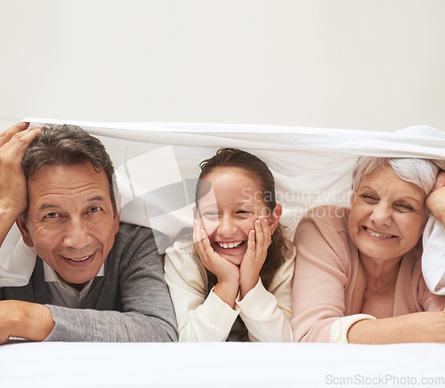 Image of Portrait, grandparents or happy girl in bedroom to relax together for bonding in Australia with love or care. Morning, faces or grandmother with funny child or old man to enjoy quality time on bed