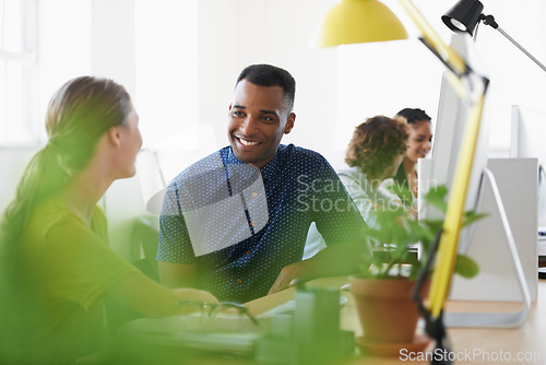 Image of Black man, break or happy people in office talking or speaking of a crazy story, gossip or news together. Funny joke, chat or employees laughing in conversation or discussion about blog at desk