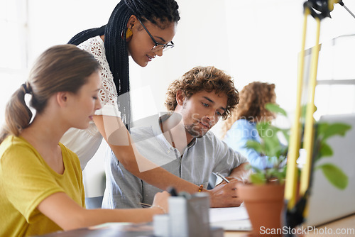 Image of Creative business people, coaching and writing in teamwork, planning or collaboration at the office. Happy woman coach training staff in project plan for strategy or ideas in startup at the workplace