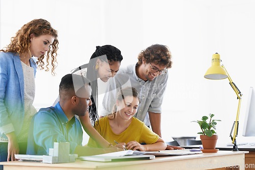 Image of Diversity, happy business people and writing in meeting for collaboration, planning or strategy at the office. Group of diverse employees working on paperwork, documents or brainstorming at workplace