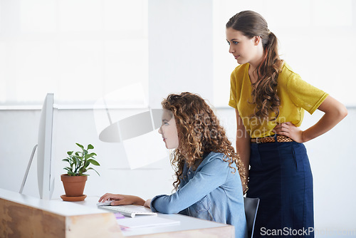 Image of Computer, women or manager coaching a worker in startup or research project in digital agency. Leadership, laptop or person helping, training or speaking of SEO data or online branding to employee