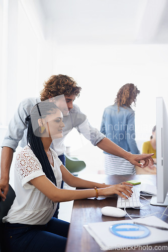 Image of Computer, pointing or manager coaching a woman in startup or research project in digital agency. Leadership, mentorship or person helping, training or speaking of online networking to female employee