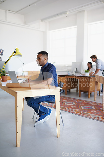 Image of Civil engineering, blueprint or black man typing on laptop working on architect project, planning or online research. Digital, designer or focused African civil engineer with floor plan on website