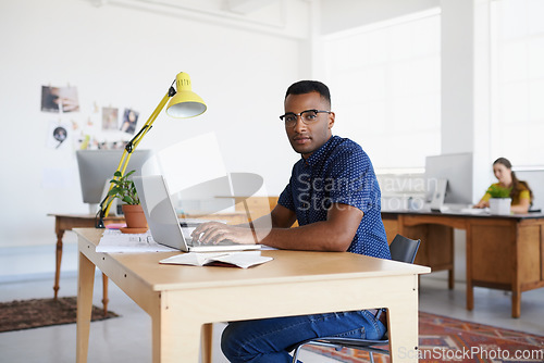 Image of Journalist, portrait or serious black man typing on laptop working on email, business project or online research. Computer, digital or focused worker copywriting on blog, reports or internet article