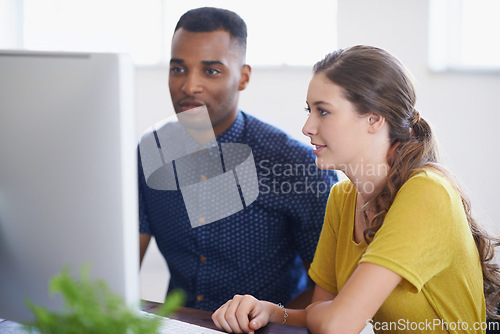 Image of Computer, people or black man coaching a worker in startup or research project in digital agency. Leadership, laptop or manager helping, training or speaking of SEO data or online branding to woman