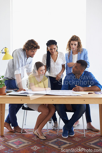 Image of Creative business people, blueprint and meeting for document planning, architecture or construction at office. Architect group in project discussion with floor plan in team collaboration for startup