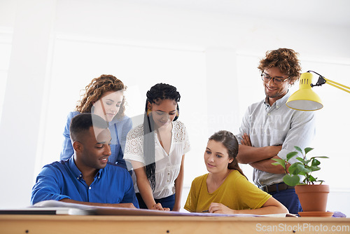 Image of Diversity, business people and documents in team strategy for planning, brainstorming or design at the office. Group of diverse employees working on paperwork in teamwork collaboration at workplace