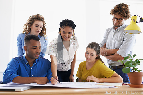 Image of Diversity, business people and writing on documents in teamwork planning, strategy or collaboration at the office. Group of diverse employees working on paperwork in team brainstorming at workplace