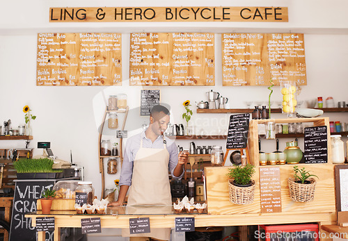 Image of Black man, cafe sign and phone of an entrepreneur with happiness from small business. Coffee shop, mobile and African barista looking on an app with a smile at bakery and restaurant feeling happy