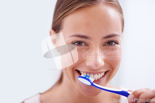 Image of Woman, portrait and brushing teeth in bathroom with smile, health and self care for oral hygiene, wellness and routine. Girl, toothbrush and happiness for cleaning, healthy mouth and start morning