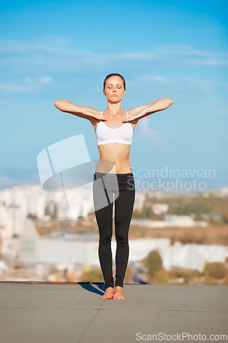 Image of Calm woman, yoga and relax on roof top for zen workout, exercise or fitness outdoors. Female yogi relaxing or posing on balcony for spiritual exercising, healthy body or wellness outside on mockup