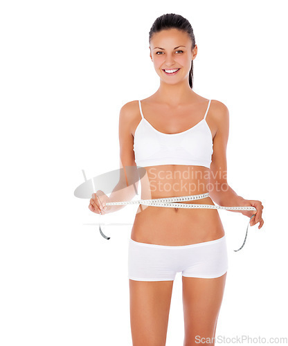 Image of Happy woman, portrait and tape measure for lose weight or diet against a white studio background. Isolated fit or slim female model in underwear or lingerie smiling for healthy body or wellness